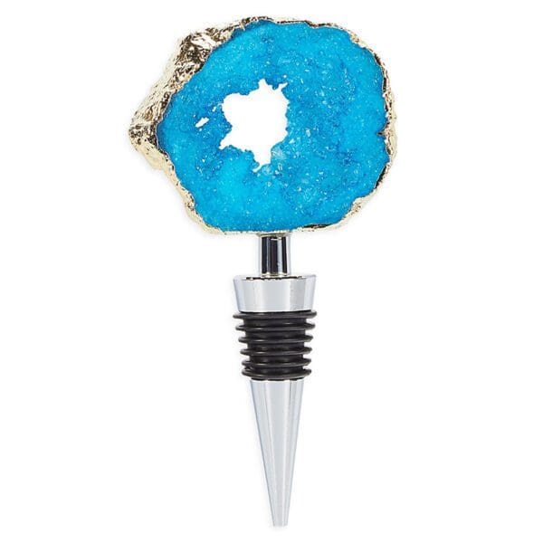 A vibrant blue agate stone bottle stopper with a natural, rough exterior and polished, hollow center, attached to a metallic and black rubber cork.