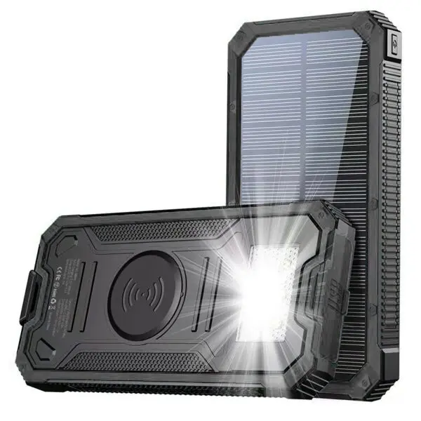 Rugged, black portable power bank with solar panels and led light illuminated, designed for durability and outdoor use.