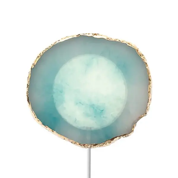 Round agate slice lollipop with a light blue center and a golden edge, displayed on a white background.