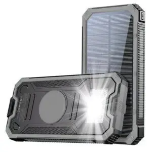 Rugged portable solar power bank with a metallic case and solar panels on its sides, featuring usb ports and led flashlight.