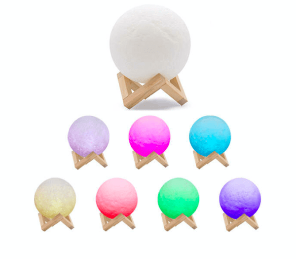 A collection of spherical lamps on wooden stands, displayed in various colors including white, purple, pink, blue, yellow, red, green, and violet.