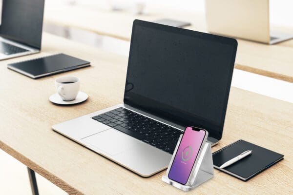 A laptop and phone on a table