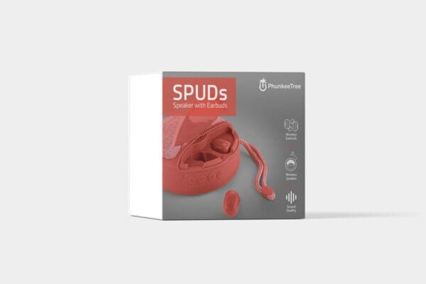 Product packaging for "spuds speaker with earbuds" in red, featuring the earbuds and speaker design details, logos, and wireless charging symbol on a grey background.