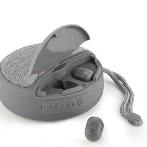 A gray wireless earbud set with one earbud next to an open charging case, featuring a fabric texture and a wrist strap.