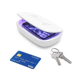 Uv light sanitizer box open with keys and a credit card next to it on a white background.