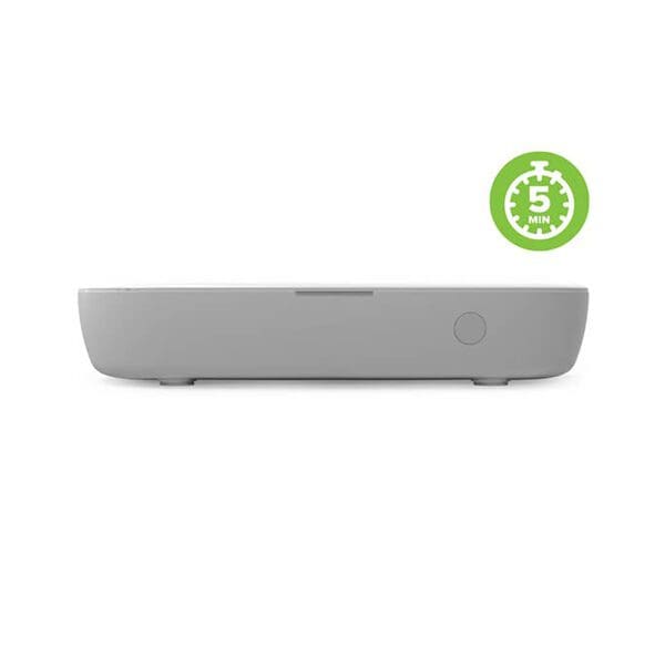 Side view of a grey minimalist docking station with a circular power button, featuring a green '5 min' sticker on the upper right.
