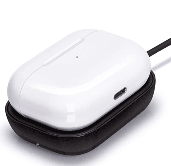 White computer mouse resting on a black charging pad, connected via a black cable.