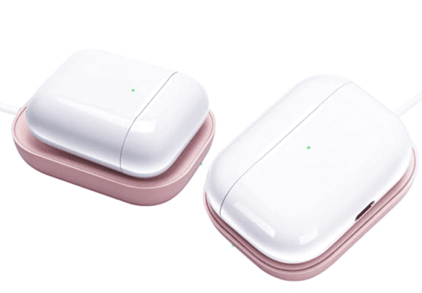 Two wireless earbud cases in white and pink, with charging cables attached, displayed on a white background.