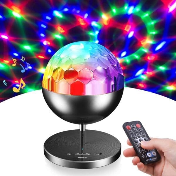 A colorful disco ball light projects vibrant lights on a wall, paired with a remote control for operation.