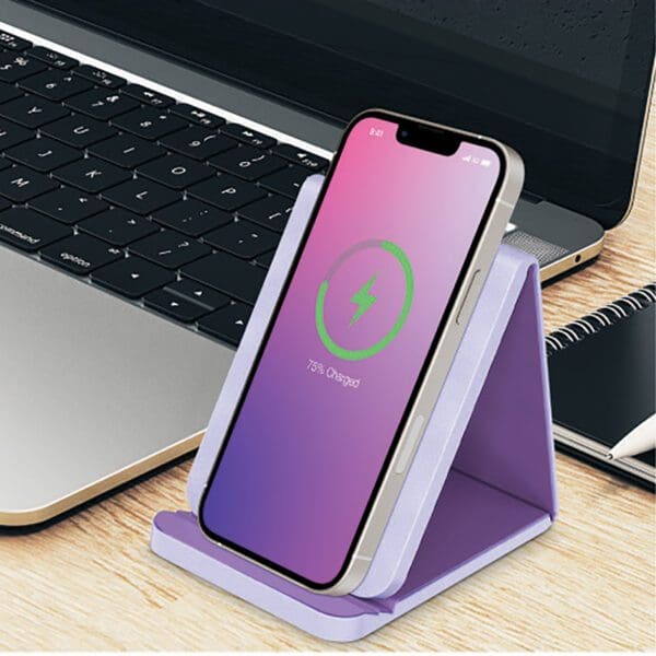 A purple phone holder sitting on top of a table.