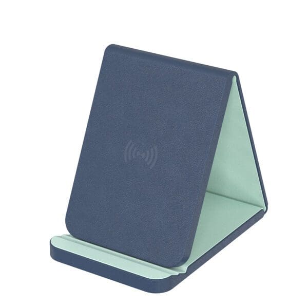 A blue and green tablet stand is sitting on top of the table.