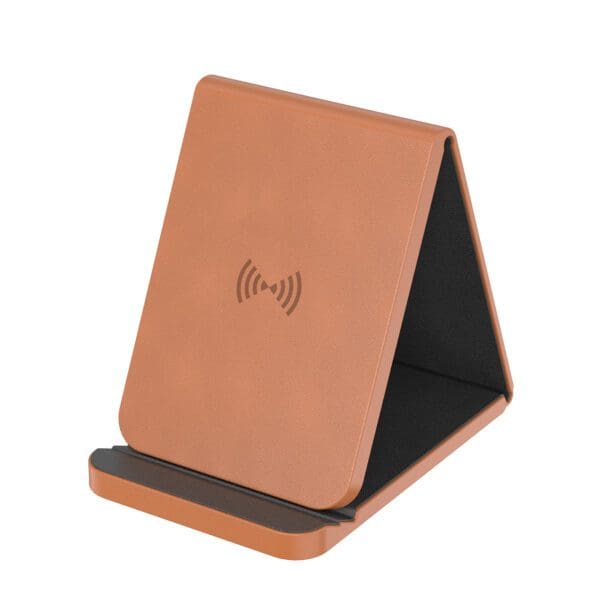 A brown leather phone holder with a wireless charging pad.