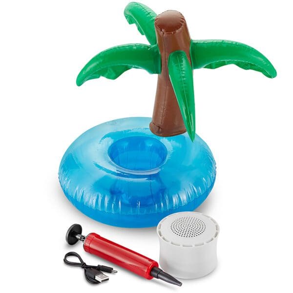 Inflatable palm tree beverage cooler with accessories including an air pump and a portable speaker on a white background.