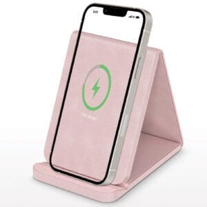A pink phone sitting on top of a stand.
