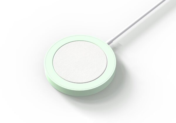 A mint green and white circular stethoscope chest piece on a white background.