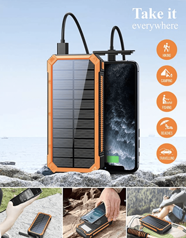 Portable solar charger with a connected smartphone on a rocky surface by the sea, with icons suggesting outdoor uses like hiking and camping.