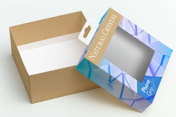 An open, empty product box with a colorful lid labeled "natural cristal" featuring a geometric design, shown on a plain white background.