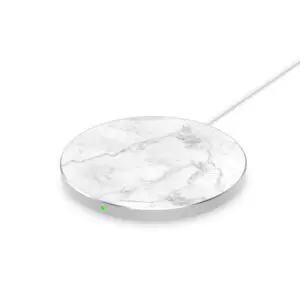 A white marble-patterned wireless charging pad with a green indicator light, isolated on a white background.