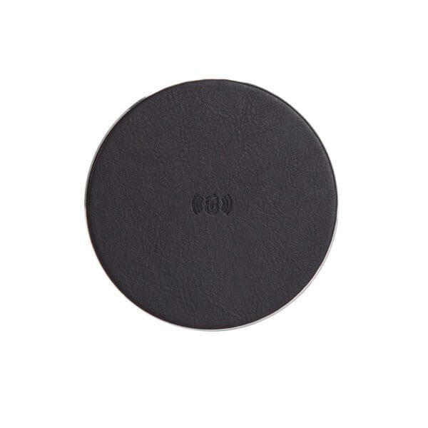 A black round pad with the word " slip " written on it.