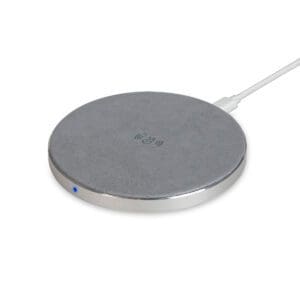 A wireless charger is sitting on top of a white surface.