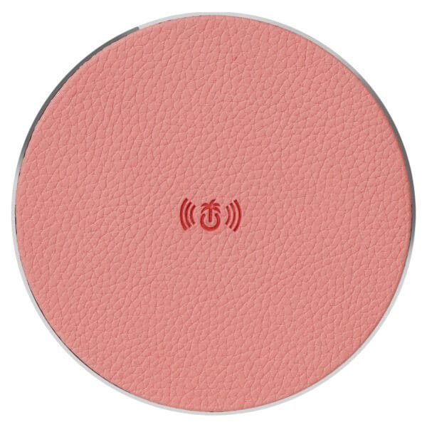 Round pink textured surface with a wireless charging symbol in the center.