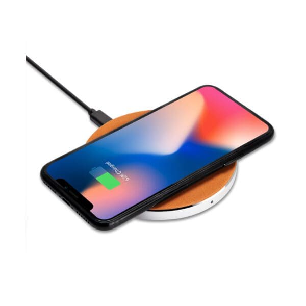 A phone is sitting on the wireless charger.