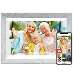 Grey Wood - Digital Picture & Video Frame and smartphone displaying a photo of a young woman, a little girl, and an elderly woman smiling and waving, with a text overlay saying "such a fun weekend".