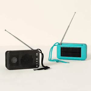 Two Solar Powered Wireless Speakers, one black and one teal, with extended antennas, on a plain background.