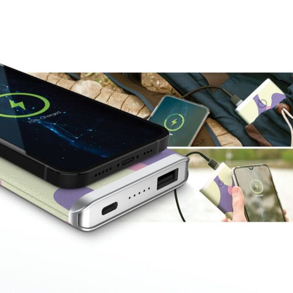 A Grey - Leather 5K Wireless Charging Power Bank charging multiple devices outdoors, including smartphones and wireless earbuds.