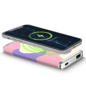 Smartphone with a cracked screen showing a battery charging icon, placed on top of a Houndsooth - Leather 5K Wireless Charging Power Bank.