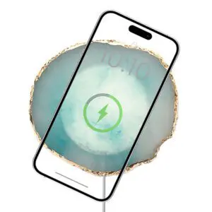 A smartphone with a Wireless Charging Crystal Pads icon on its screen, centered over a blurred turquoise and gold background.