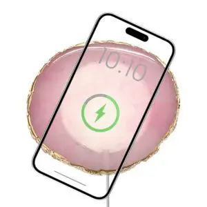 Wireless Charging Crystal Pads displaying a wireless charging icon with a translucent pink background overlaying an image of a sliced fruit, possibly a grapefruit, visible through the screen.