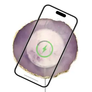 Smartphone displaying a Wireless Charging Crystal Pad symbol over a purple crystal background, indicating battery being charged.