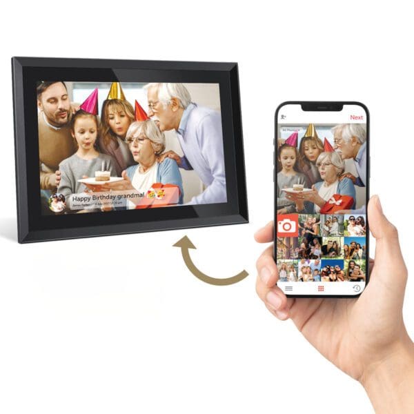 A person uses a smartphone with an app to remotely view and control a Digital Picture & Video Frame displaying a family celebrating a birthday.