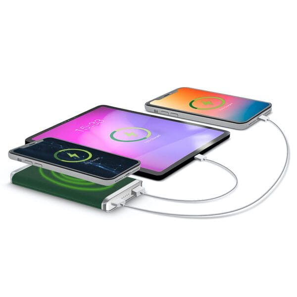 Four electronic devices, including smartphones and tablets, charging simultaneously on a Grey - Leather 5K Wireless Charging Power Bank.
