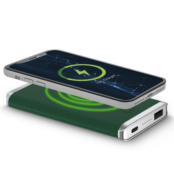 Smartphone on a Leather Wireless Charging Power Bank with a glowing green light, indicating charging status.