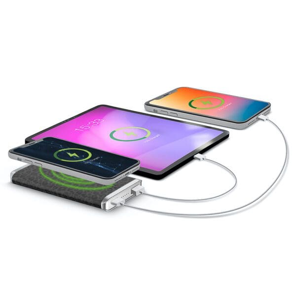 Three smartphones with colorful screens charging on a Grey - Leather 5K Wireless Charging Power Bank, connected by cables on a white background.