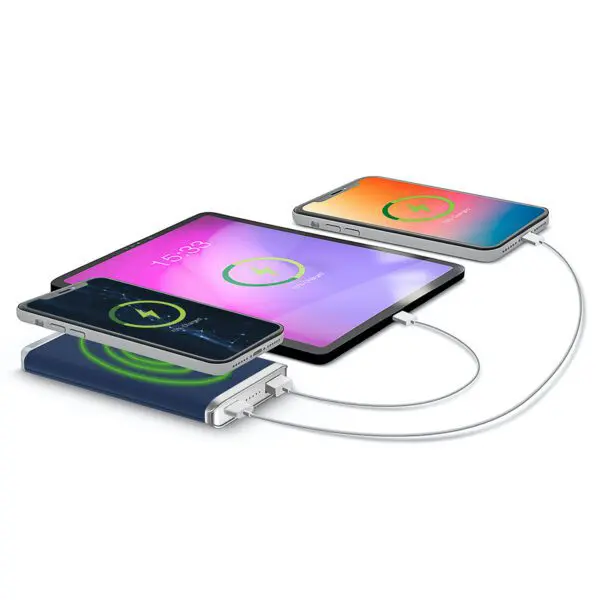 Three smartphones charging on a Leather Wireless Charging Power Bank with visible battery charge indicators on their screens.