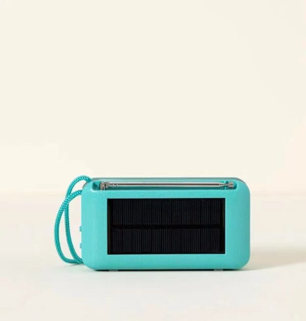 Teal Solar Powered Wireless Speaker with a wrist strap, displayed against a plain light background.