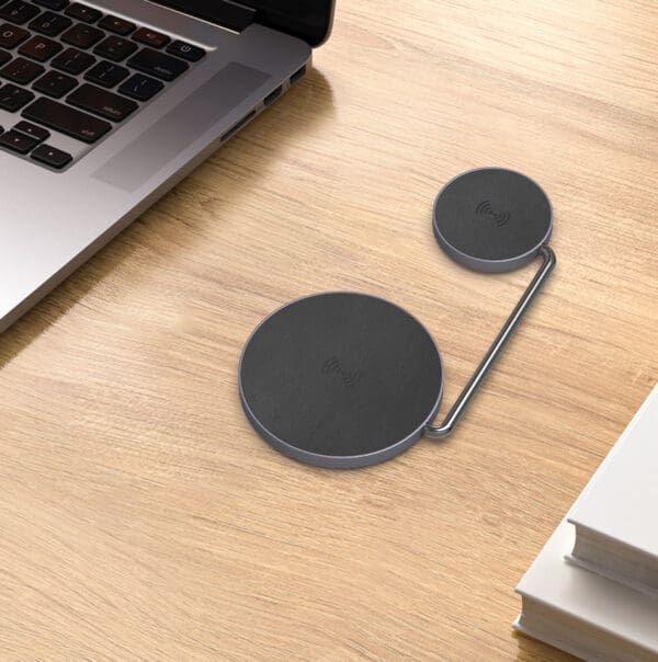 Wireless charging pads on a desk.