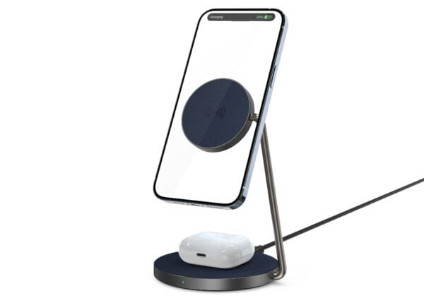 Wireless charger with phone and earbuds.